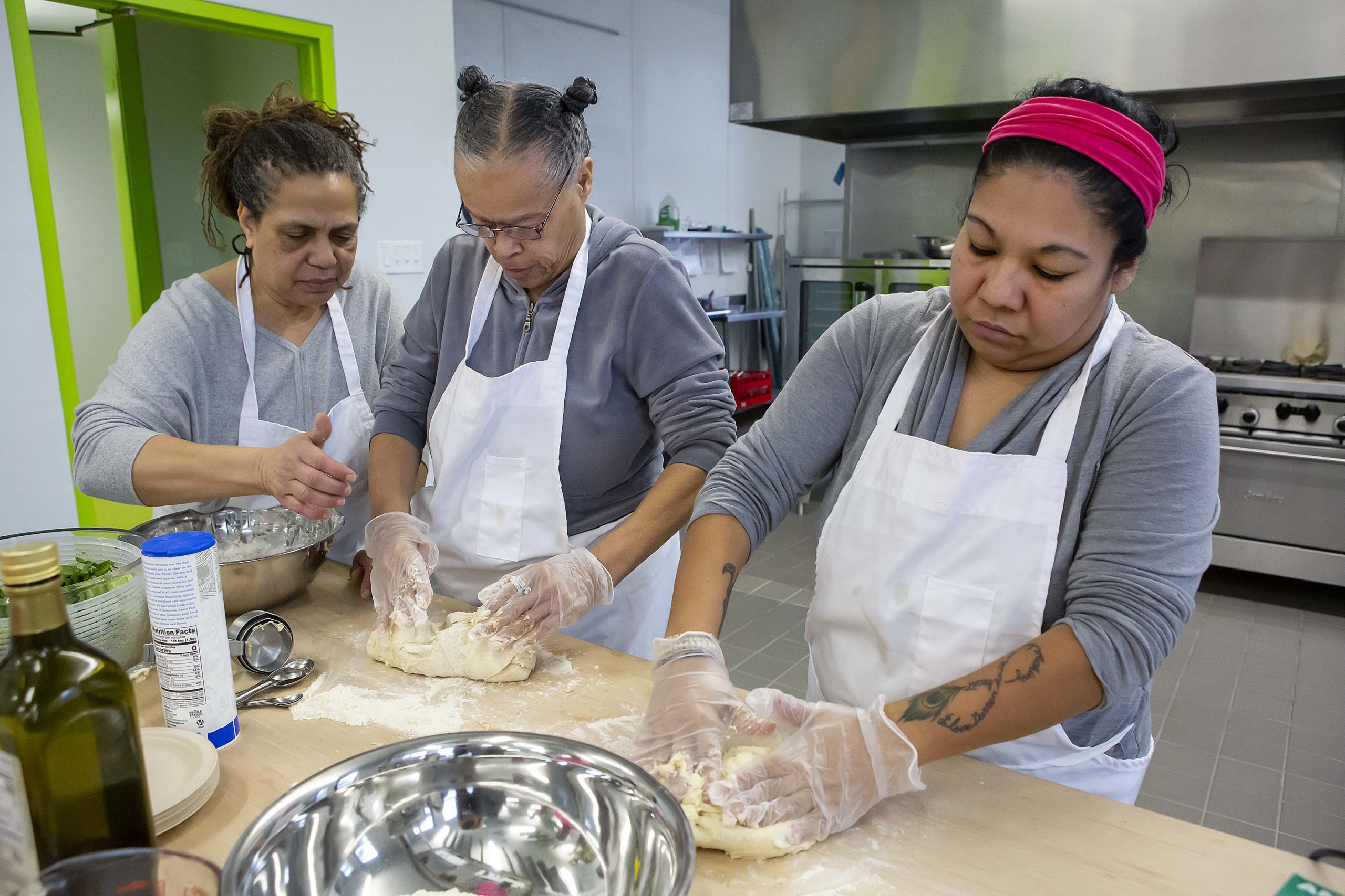 three women working in the kitchen